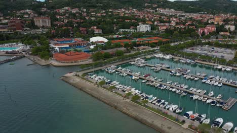 Drone-aerial-forward-flying-seaside-coastal-view-of-Portoroz-ATP-Challenger-Slovenia-Open-tennis-grounds