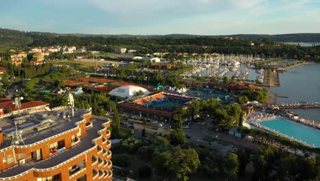 Drone-aerial-slow-left-rotating-flying-view-of-sunset-light-Portoroz-before-ATP-Challenger-Slovenia-Open-tennis