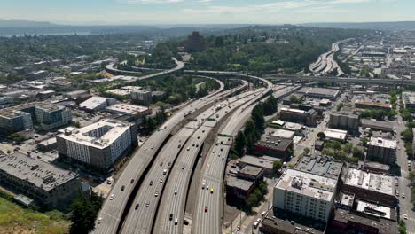 Wide-drone-shot-of-cars-commuting-on-Seattle's-freeway-system