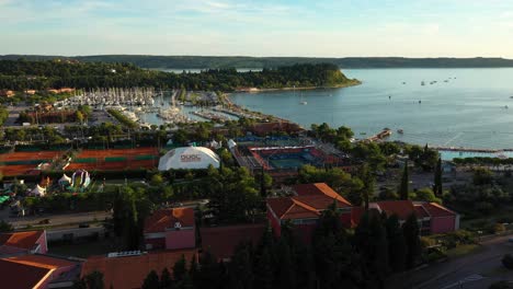 Drone-aerial-slow-left-rotating-flying-view-of-sunset-Portoroz-before-ATP-Challenger-Slovenia-Open-tennis-venue