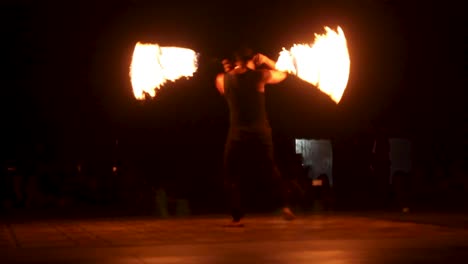 Watching-a-fire-dancer-by-the-beach-of-Dubai-during-the-night---wide
