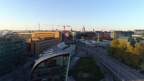 Quiet-downtown-of-Helsinki,-Aerial-view-overlooking-lack-of-people-and-traffic-on-the-Mannerheimintie-avenue,-sunny,-summer-morning,-in-Kluuvi,-Helsingfors,-Finland---Empty-due-to-Covid-19