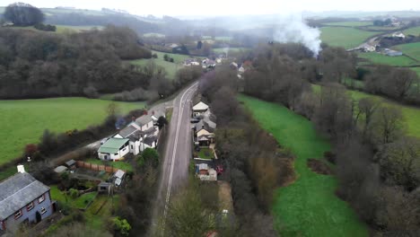 Aerial-of-English-Devon-Countrside,-with-Bonfire-in-the-distance