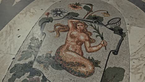 Mosaic-mermaid-at-Galleria-Umberto,-Naples