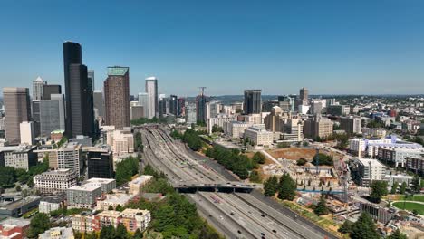 Wide-drone-shot-of-cars-commuting-into-Seattle's-downtown-area