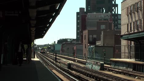 Subway-Train-Going-Past-Station-Platform-In-Brooklyn