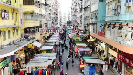 Many-People-Walking-Down-The-Streets-Where-Several-Stalls-Lining-Up-During-A-Festival-In-Hong-Kong---Timelapse