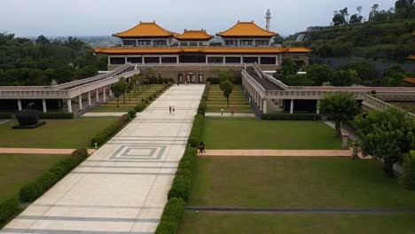 Drone-aerial-forward-descending-flying-view-of-Fo-Guang-Shan-golden-Buddha-Museum-complex