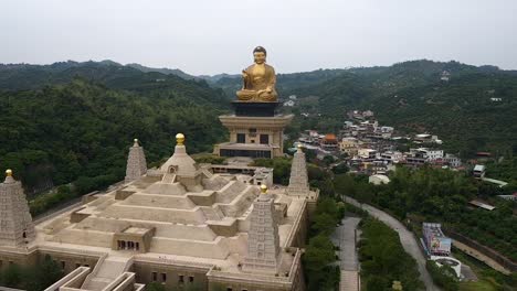 Drone-aerial-right-rotating-flying-view-of-Fo-Guang-Shan-golden-Buddha-statue-Museum-complex,-Taiwan
