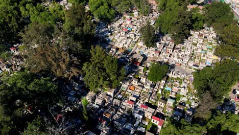 Aerial-orbit-of-the-tombstones-of-the-General-Cemetery-of-Iztapalapa-on-a-sunny-day-in-CDMX,-Mexico