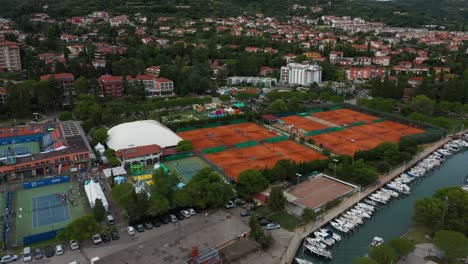 Drone-aerial-fast-forward-flying-seaside-coastal-view-of-Portoroz-ATP-Challenger-Slovenia-Open-tennis-grounds