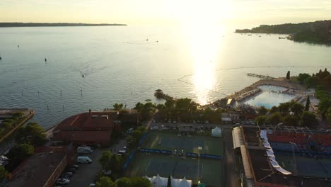 Drone-aerial-forward-fast-moving-flying-view-of-Portoroz-in-yellow-sunset-light,-Slovenia