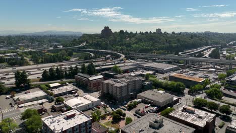 Drone-shot-over-Seattle's-International-District-with-the-main-freeways-in-the-distance