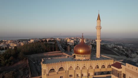Drone-Flying-Above-Nebi-Saeen-Mosque,-Nazareth,-Israel-at-Sunset