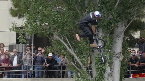 Freestyle-BMX-cycles-rider-performing-a-jump-based-stunt-in-urban-bike-park