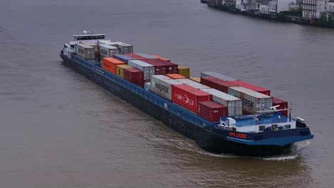 Container-vessel,-FPS-IJSSEL-flying-the-flag-of-Netherlands-at-Dordrecht