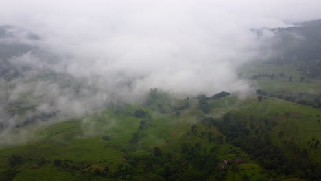 Misty-Clouds-Over-Green-Valleys-In-Nepal,-South-Asia