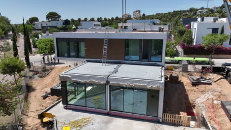 Aerial-drone-view-of-prefabricated-modular-house-in-construction-site-work-area