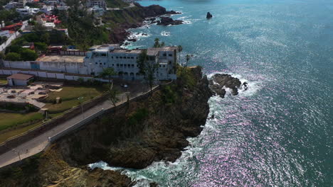 Aerial-view-around-a-old-building-on-the-coast-of-Mazatlan,-sunny-day-in-Mexico