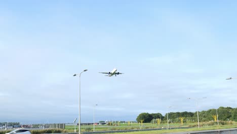 Substantial-Sky-airliner-passing-over-vehicle-highways-to-land-at-Schiphol