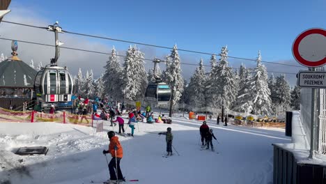 People-at-the-ski-resort-in-Pec-Pod-Snezkou,-Chairlift-at-a-ski-resort