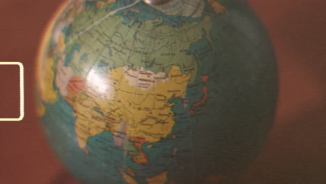 Rotating-globe-displaying-all-continents-in-detail