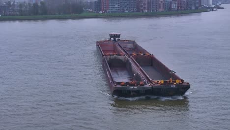Barge,-propelled-by-reliable-engine-moves-steadily-through-the-water