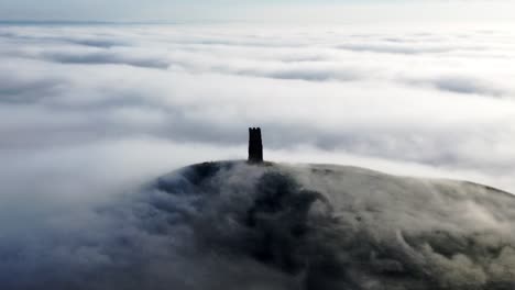 Glastonbury-Tor,-Somerset-with-mist-rising-over-it