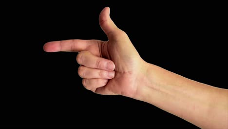 Close-up-shot-of-a-male-hand-pointing-to-the-left,-against-a-plain-black-background