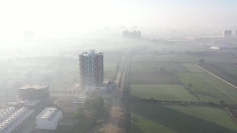 aerial-drone-shot-drone-camera-back-side-of-many-residential-houses-and-sun-rays-falling-on-high-rise-building