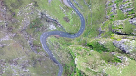 Aerial-shoot-of-car-driving-through-cheddar-gorge