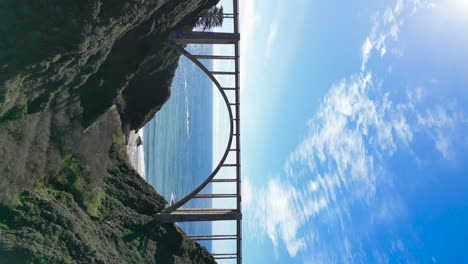 Drone-flying-under-a-bridge-on-the-iconic-highway-101-near-Big-Sur-California