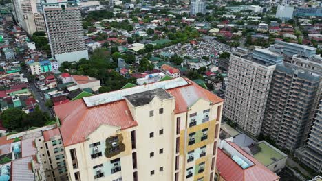 Overhead-aerial-view-of-condo-buildings-and-urban-communities-in-West-Crame,-San-Juan-City,-Philippines