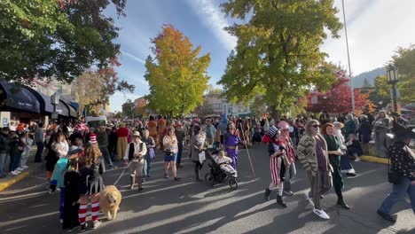 A-crowd-walking-by-during-a-parade-celebrating-Halloween