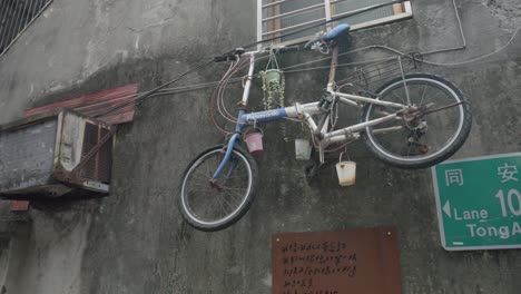 Bicycle-Hanging-on-Urban-Wall-in-Taipei