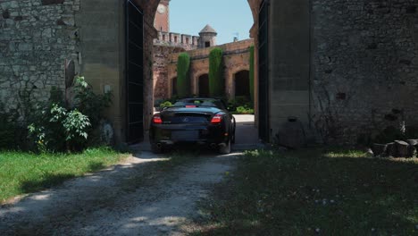 Luxury-Car-entering-Château-de-Pouzilhac-Gates