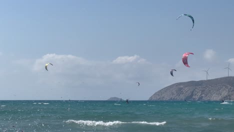 Lots-of-people-kite-surfing-near-the-coast-of-Paralia-Prasonisiou,-Rhodes