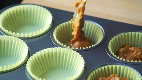 Close-up-of-batter-in-to-pan-for-vegan-pumpkin-muffins-using-real-roasted-pumpkin-in-bowl-healthy-dairy-free-recipe-vegan