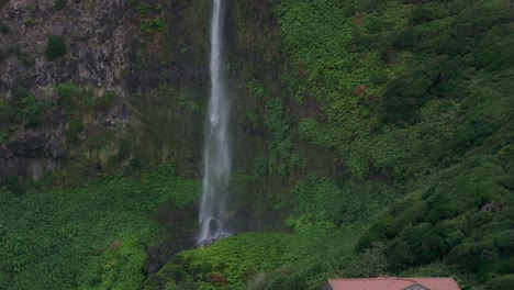 Picturesque-rural-waterfall-in-lush-green-vegetation-at-Azores,-aerial
