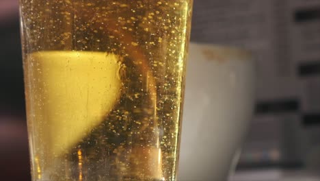 Bright-Day-Bar-Scene:-Beer-Glass-in-Slow-Motion-Close-Up