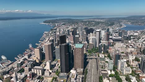 Wide-drone-shot-of-Seattle's-downtown-sector-with-numerous-skyscrapers-standing-tall