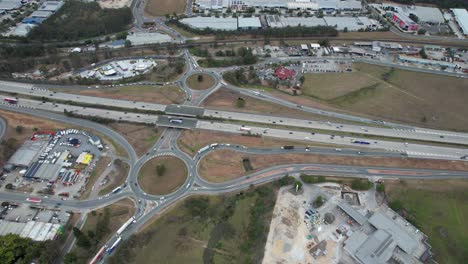Aerial-View-Of-Pacific-Motorway-And-Roundabouts-In-Yatala,-Suburb-In-Gold-Coast,-Queensland