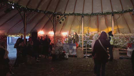 People-Inside-The-Tent-With-Christmas-Decor-In-Dublin,-Ireland