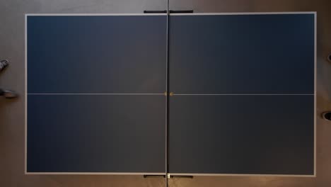 Top-down-shot-showing-table-tennis-ping-pong-game,-drone-shot
