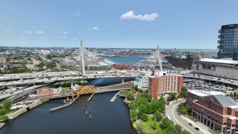 Drone-shot-of-The-Zakim-bridge-in-Boston-on-a-sunny-day-with-cars-driving-over-it