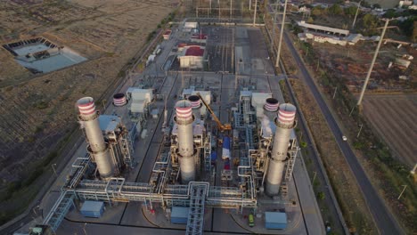 Aerial-sunset-shot-of-an-electric-power-plant