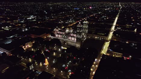 Night-aerial-shot-in-orbit-of-the-cathedral-and-Zocalo-of-Puebla-Mexico