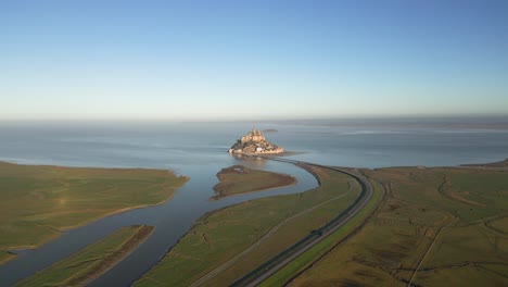 Mont-Saint-Michel-from-Afar-in-Broad-Daylight,-4K-Aerial-Drone