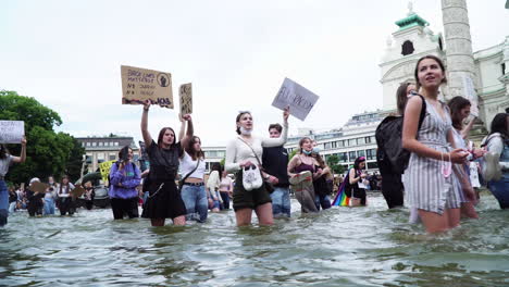 A-young-generation-is-demonstrating-emotionally-in-the-knee-deep-water-against-racism-and-violence-in-front-of-the-Karlskirche-in-Vienna