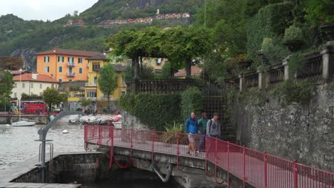 Three-Young-Men-Walking-on-the-Stone-Path-in-Varenna-Town